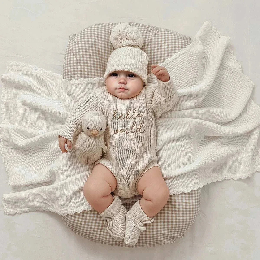 Newborn knitted "Hello World" romper and pom-pom hat photography outfit for baby photoshoots