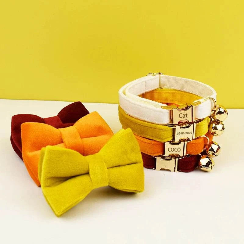 Adjustable cat collar with bowknot, bell, quick release, and engraveable ID tag for pet safety and comfort